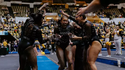 Senior Jocelyn Moore celebrates with teammates after her vault routine against No. 6 Kentucky on Jan. 26, 2025.