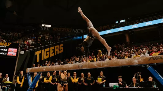 Amari Celestine performing on the balance beam during the team's Beauty and the Beast meet on January 3, 2025.
