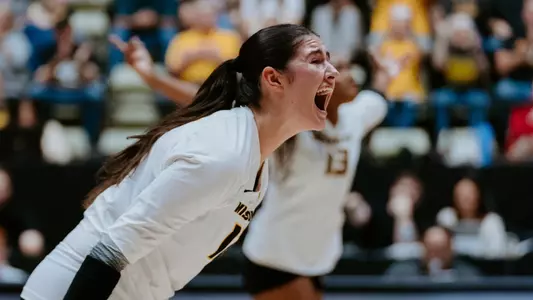 Janet deMarrais celebrating as she posted a block against Arkansas