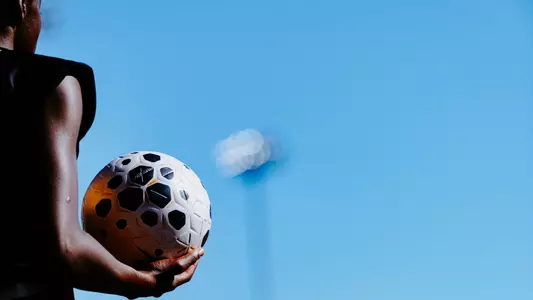 Mizzou soccer player holds the ball prior to a throw in.