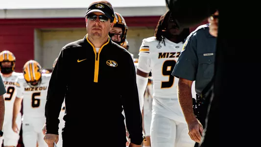 Eliah Drinkwitz walks out of the locker room prior to Mizzou's game against UMass
