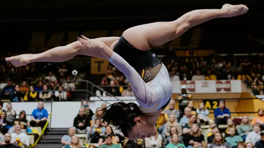 Redshirt senior Helen Hu during her balance beam routine at the team's senior day meet against Auburn on March 9, 2025.