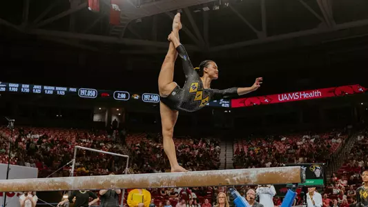 Helen Hu during her beam routine, which earned a score of 10.000, during the team's meet at Arkansas on March 14, 2025.