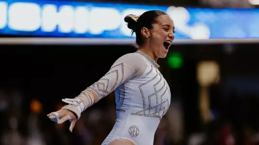 Mara Titarsolej celebrating after she scored 10 on uneven bars during the SEC Championship meet on March 22, 2025.