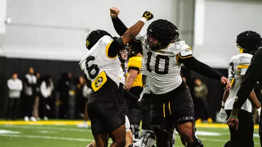 Jalen Catalon and Sterling Webb celebrate during spring practice