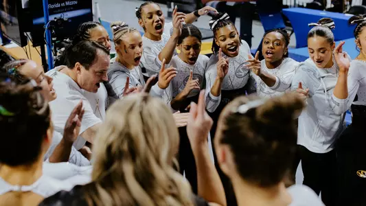 The Mizzou gymnastics team prepares together prior to its meet at Florida on Feb. 28, 2025.