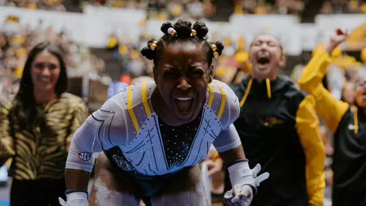 Amari Celestine celebrates after her routine on uneven bars during the team's senior day meet against Auburn on March 9, 2025.