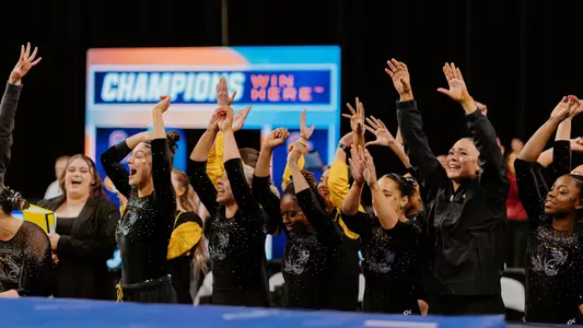 The Mizzou gymnastics team celebrating during its beam rotation at the NCAA Championship Semifinal meet on Thursday, April 17, 2025 at Dickies Arena.