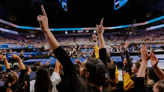 Mizzou gymnast Olivia Kelly celebrating after the team advanced to its first NCAA Championship Final in program history on April 17, 2025.