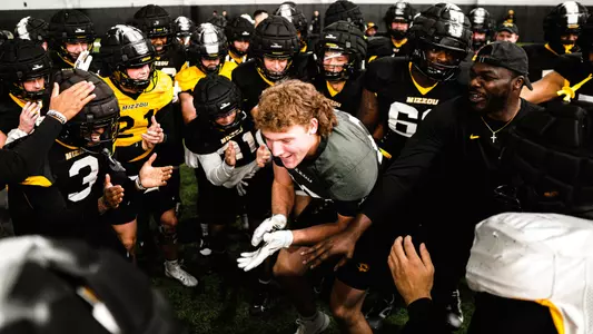 Brett Norfleet gets the Tigers hyped during pre-practice spring warm ups