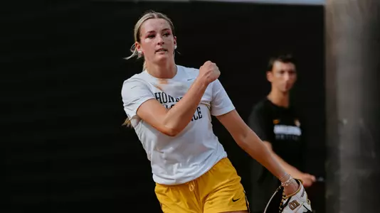 Abby Carr pitching in the bullpen during practice