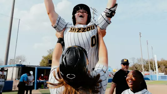 Abby Hay Holds Up Sidney Forrester after her home run against Houston