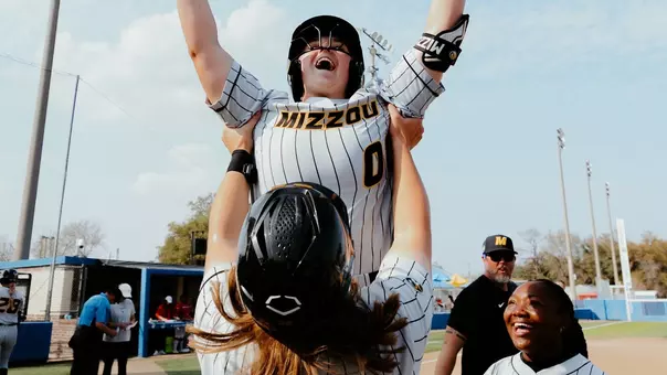 Abby Hay Holds Up Sidney Forrester after her home run against Houston