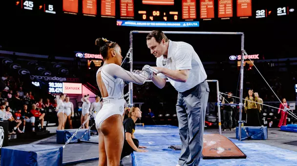 Mizzou gymnastics head coach Shannon Welker gives a pep talk to freshman Kimarra Echols before her bars routine at the Tigers' meet against Georgia on March 6, 2026.