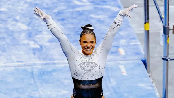 Mizzou gymnast Makayla Green celebrating after completing her uneven bars routine at the Mizzou Quad on Feb. 20, 2026.