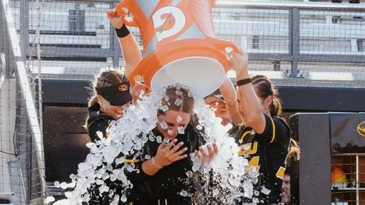 Junior Stefania Abruscato gets gatorade dumped on her following the victory over No. 4 Alabama