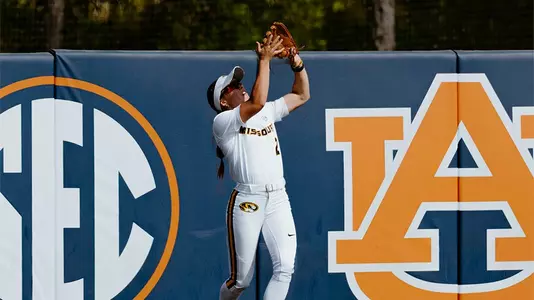 Danielle Blackstun catches the ball in the outfield against Auburn