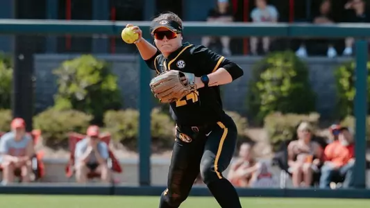 Madison Uptegrove throws out a runner at Georgia