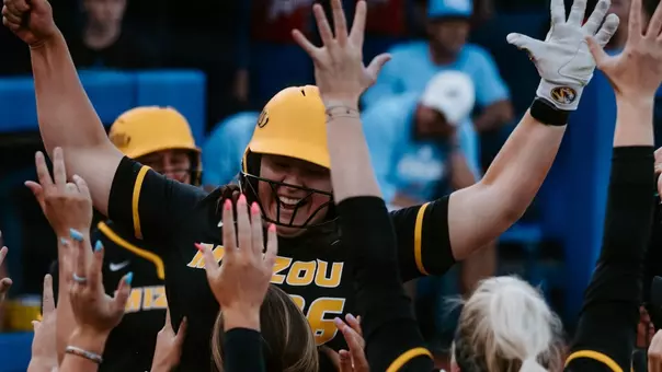 Junior Abby Hay celebrates as she hits the go-ahead home run against Kansas