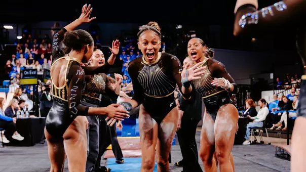 Freshman Kimarra Echols celebrates with the Mizzou gymnastics team after her vault at Kentucky on Feb. 13, 2026.