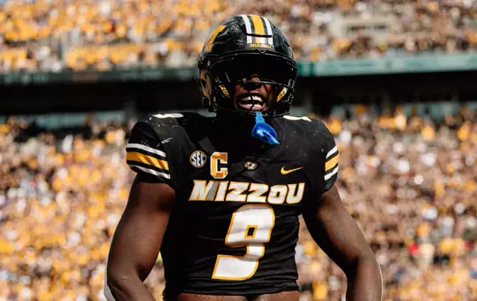 Missouri come from behind to defeat Kansas, 42-31, at Memorial Stadium.