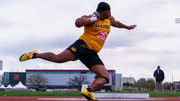 Chase Crawford positions himself to throw as he competes in shot put at the Big Red Classic in Lincoln, Neb.