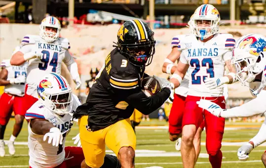 Missouri come from behind to defeat Kansas, 42-31, at Memorial Stadium.