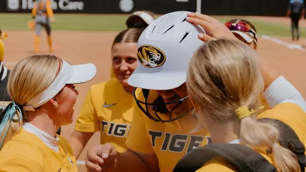 Abby Hay celebrated after hitting a home run for her 100th career hit