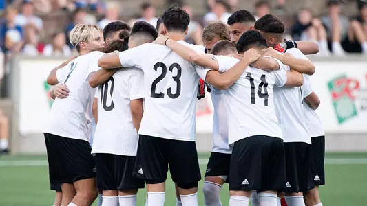 Men's soccer huddle