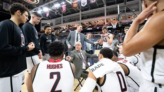 Omaha men's basketball huddle