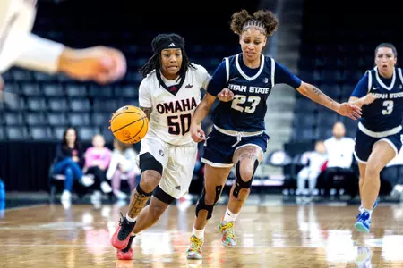 Ja Harvey drives against Utah State
