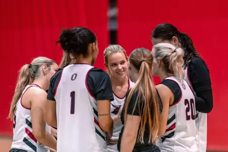 Katie Keitges leads the huddle