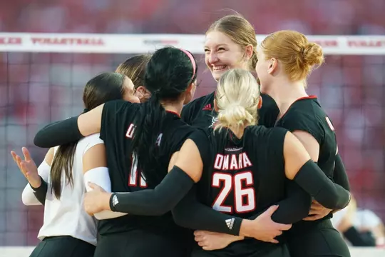 Volleyball team hugging