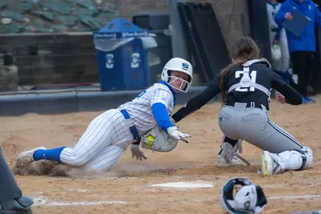 Rylinn Groff tags out Creighton runner at home