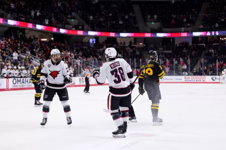 Aidan de la Gorgendiere and Trevor Wong celebrate Hyland's goal against (RV) Colorado College