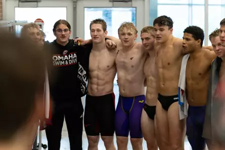 Men's Swim & Dive Team Celebrates Win Over Rockhurst