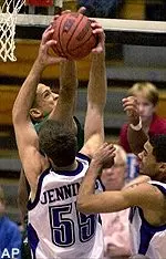 Jacksonville's Brandon Williams battles for a rebound against Northwestern's Aaron Jennings in the first half in Evanston, Ill. Tuesday.