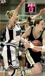 PU's Katie Douglas calls for<br>time under pressure from Megan<br>Chawansky in the first half.