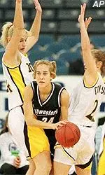 Megan Chawansky fights<BR>through two Purdue defenders<BR>during Saturday's game.