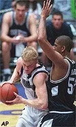 Evan Eschmeyer works past<BR>Penn State's Calvin Booth during<BR>the first half Wednesday.