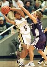 Ukari Figgs is pressured<BR>by Northwestern's Dana Leonard<BR>during first-half on Tuesday.