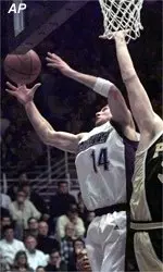Steve Lepore grabs a rebound<BR>away from Purdue's Brian Cardinal<BR>in the first half Wednesday.