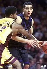 Northwestern's Ben Johnson is fouled by Minnesota's Kevin Burleson during the first half in Minneapolis on Saturday.