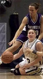 Ashley Messenger fights for a loose ball with Purdue's Kelly Komara