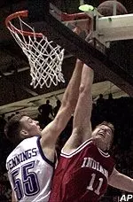 Aaron Jennings battles on the boards with Indiana's Dane Fife during Saturday's contest.
