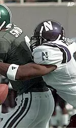 Dwayne Missouri makes the sack and forces a fumble during the first quarter Saturday.