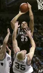 Tavaras Hardy goes up for a shot over PSU's Tyler Smith and Jon Crispin