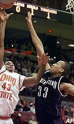 Northwestern's Tavaras Hardy (33) tries to block OSU's Will Dudley (43) Wednesday night
