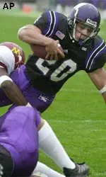 Damien Anderson stretches into the endzone for a touchdown in the Wildcats' win over Minnesota Saturday.