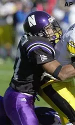 Raheem Covington brings down a Hawkeye player in the Wildcats' game Saturday.
